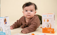 Baby in sweater with Stage 1 and Stage 2 Mix-Ins