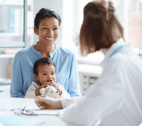 Mom and baby consult with pediatrician