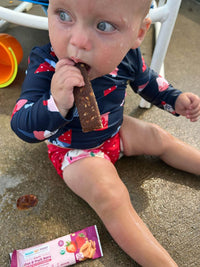 Baby Lucy enjoying an RSF! Peanut Butter Strawberry bar